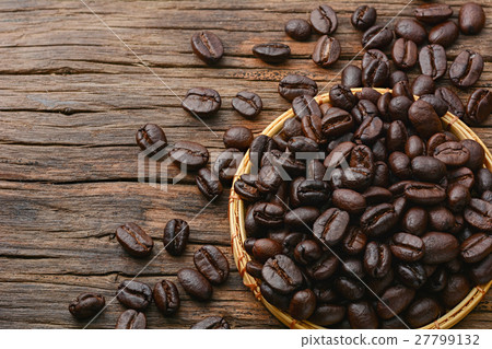 Coffee beans on brown wooden table 27799132