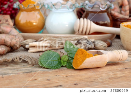 Turmeric powder with honey and milk for scrub. Turmeric powder with honey and milk for scrub. 27800959