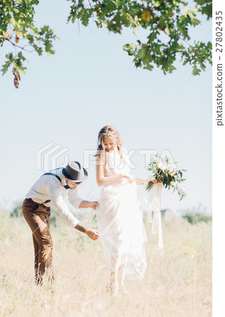 bride and groom hugging at the wedding in nature. 27802435