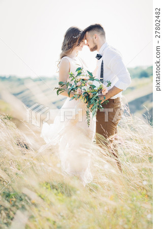 bride and groom hugging at the wedding in nature. 27802482