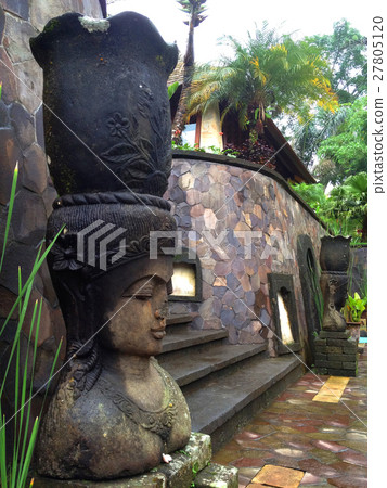 Indonesia Bali Ubud Stone statues wet with rain 27805120