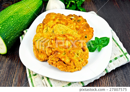 Flapjack chickpeas with zucchini on dark board Flapjack chickpeas with zucchini on dark board 27807575