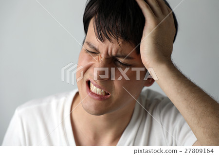 A man with a headache A man with a headache 27809164