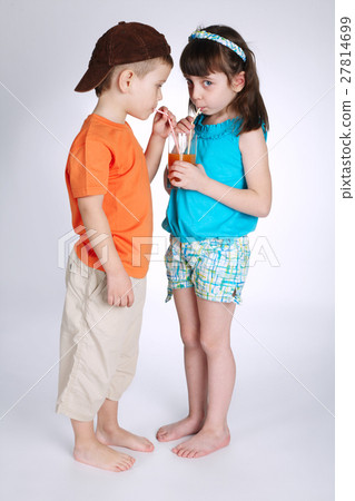 little boy and girl drinking juice little boy and girl drinking juice 27814699