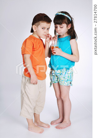 little boy and girl drinking juice little boy and girl drinking juice 27814700
