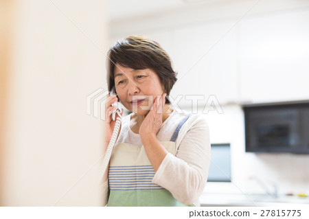 Senior woman taking suspicious phone 27815775