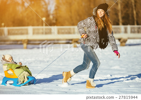 mother and daughter in winter outdoors 27815944