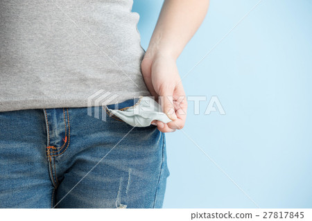 woman showing her empty pockets 27817845