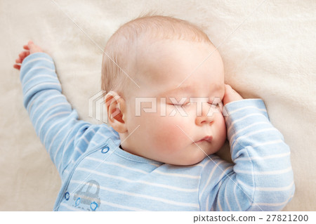 Baby sleeping covered with soft blanket 27821200