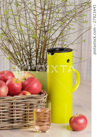 apples, glass of juice and thermos jug 27821645
