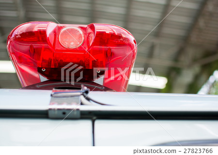 red flashing sirens of police car during the roadb 27823766