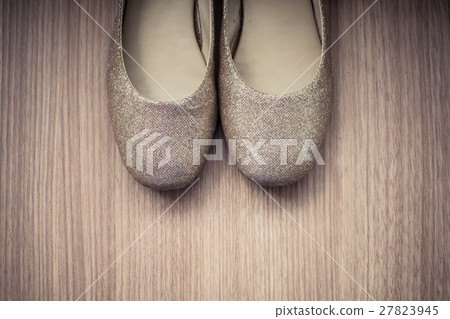 Women shoes old on a wood background 27823945
