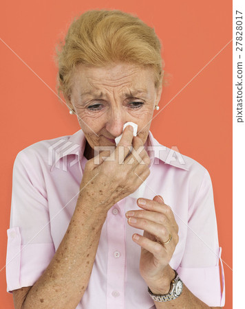 Senior Women Blowing Nose Concept 27828017