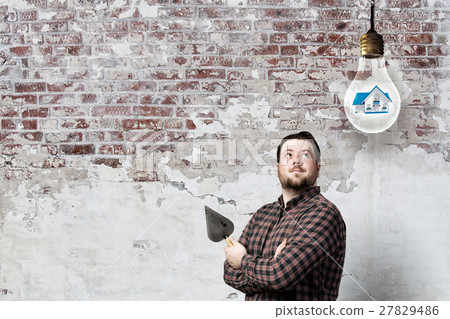 Handyman with tool in interior Handyman with tool in interior 27829486