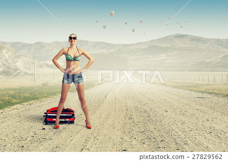 Hitch hiker woman on road 27829562