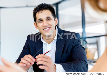 Businessman at the office Businessman at the office 27829877