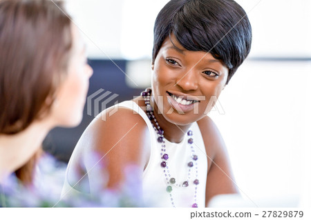 Women working together, office interior 27829879