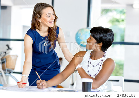 Women working together, office interior 27830195