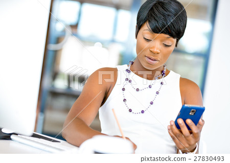 Portrait of smiling business woman with mobile Portrait of smiling business woman with mobile 27830493