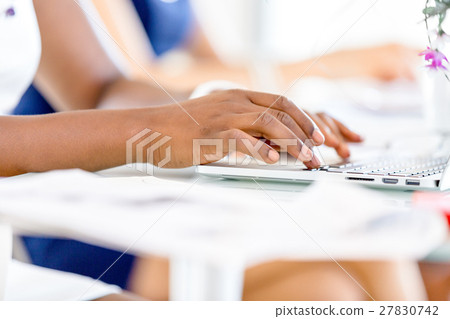 Image of woman's hands typing 27830742