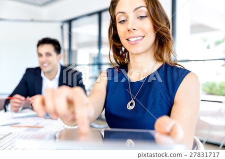 Young woman in office using tablet 27831717
