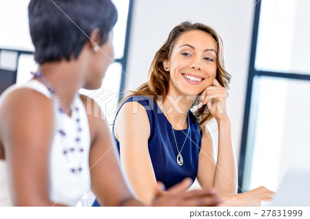 Women working together, office interior Women working together, office interior 27831999