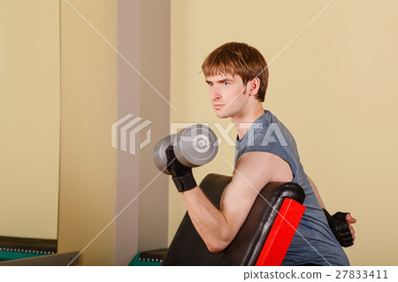 Man exercise biceps with hand weights 27833411