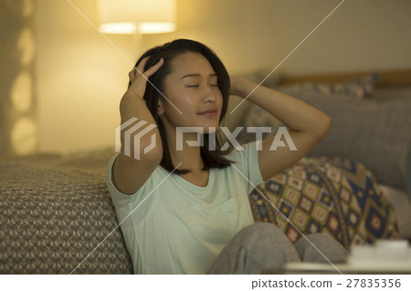 A young lady massaging the scalp A young lady massaging the scalp 27835356