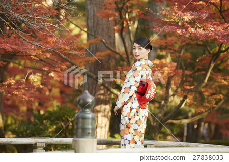 Brilliant autumn leaves and kimono female portrait 27838033