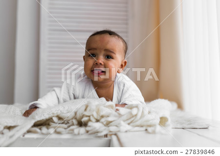 Laughing Mixed Race Baby Boy Lying On Tummy At Laughing Mixed Race Baby Boy Lying On Tummy At 27839846