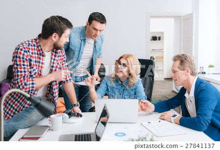 Attractive young woman pointing at her colleague Attractive young woman pointing at her colleague 27841137