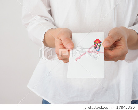 A woman giving out a bag 27843359