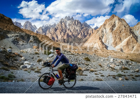 Cyclist on Karakorum Highway Cyclist on Karakorum Highway 27843471