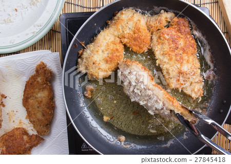 Chef deep fried pork in pan 27845418