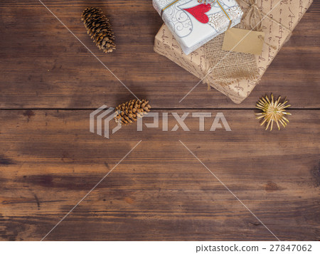 Vintage gift box, fir cones with Christmas toy on 27847062