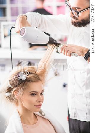 Young lady is sitting at beauty salon 27847387