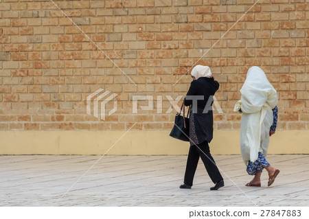 Three muslim woman walking on the street 27847883
