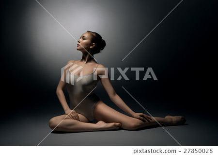 Sexy gymnast in ecru bodysuit in split in profile 27850028