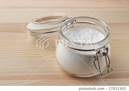 Open glass jar of baking soda Open glass jar of baking soda 27852303