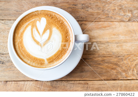 Cup of coffee latte art on wood table Cup of coffee latte art on wood table 27860422