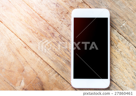 Mobile phone with blank screen mockup on wood table background, clipping path inside 27860461