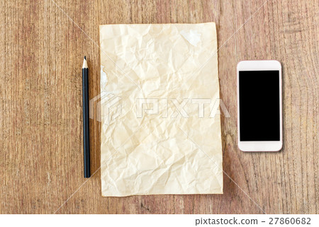 White paper with smart phone on wooden table 27860682