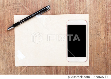 White paper with smart phone on wooden table 27860715