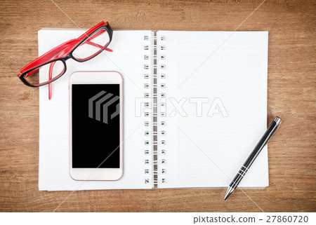 Top view of Open Notebook and smart phone on wood table for background Top view of Open Notebook and smart phone on wood table for background 27860720