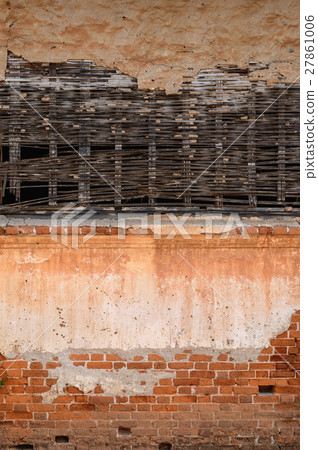 Old wall combination by brick and bamboo webbed Old wall combination by brick and bamboo webbed 27861006