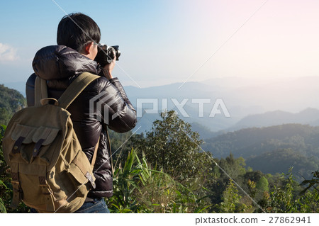 Young professional traveler man with camera Young professional traveler man with camera 27862941