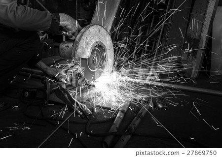Worker use Electric grinder cut metal  27869750