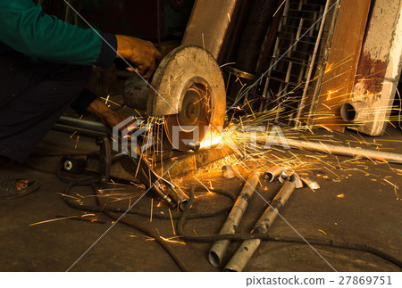 Worker use Electric grinder cutting metal Worker use Electric grinder cutting metal 27869751