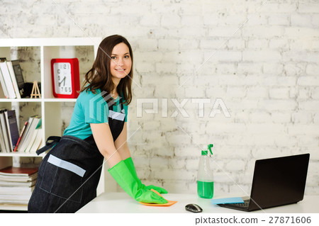 cleaning lady cleans table 27871606