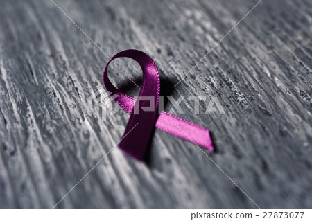 pink ribbon on a wooden surface pink ribbon on a wooden surface 27873077